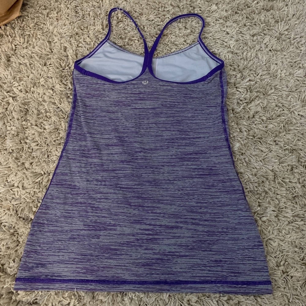 Grey and purple lululemon tank top with sport bra installed in it